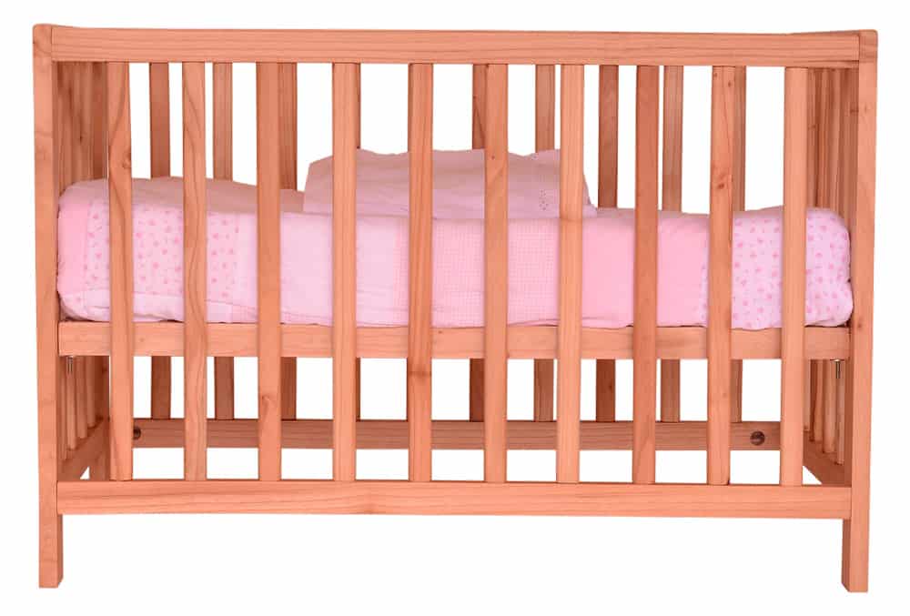Crib with Pink blanket